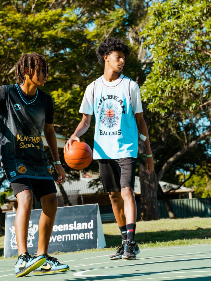 Basketball participants from the Take It to the Streets source page in the mentoring brochure